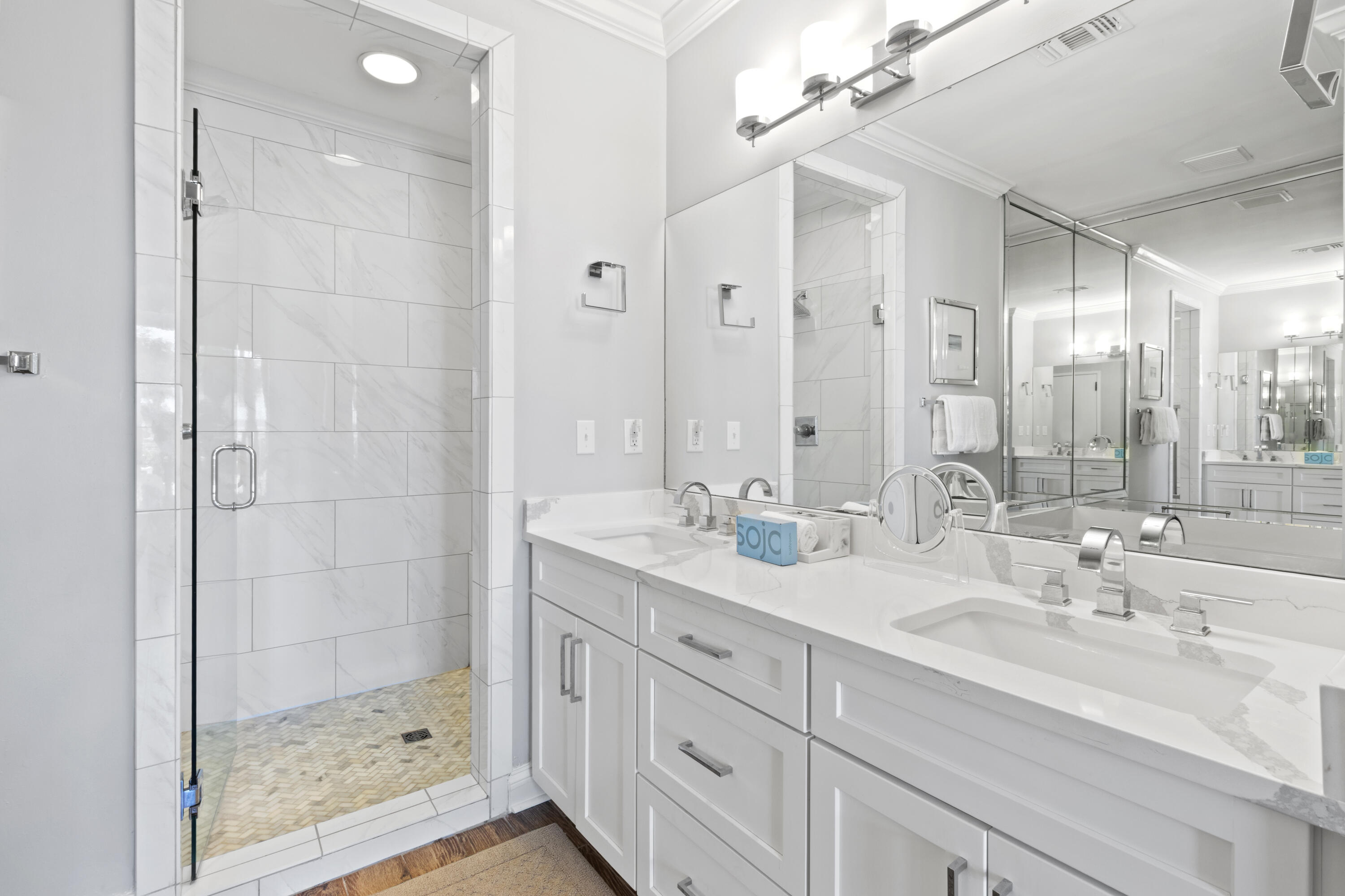 550 Tops'l Beach Boulevard, Unit 103 Miramar Beach, FL 32550 - Photo 13 of 20 a bathroom with a double vanity sink mirror and shower