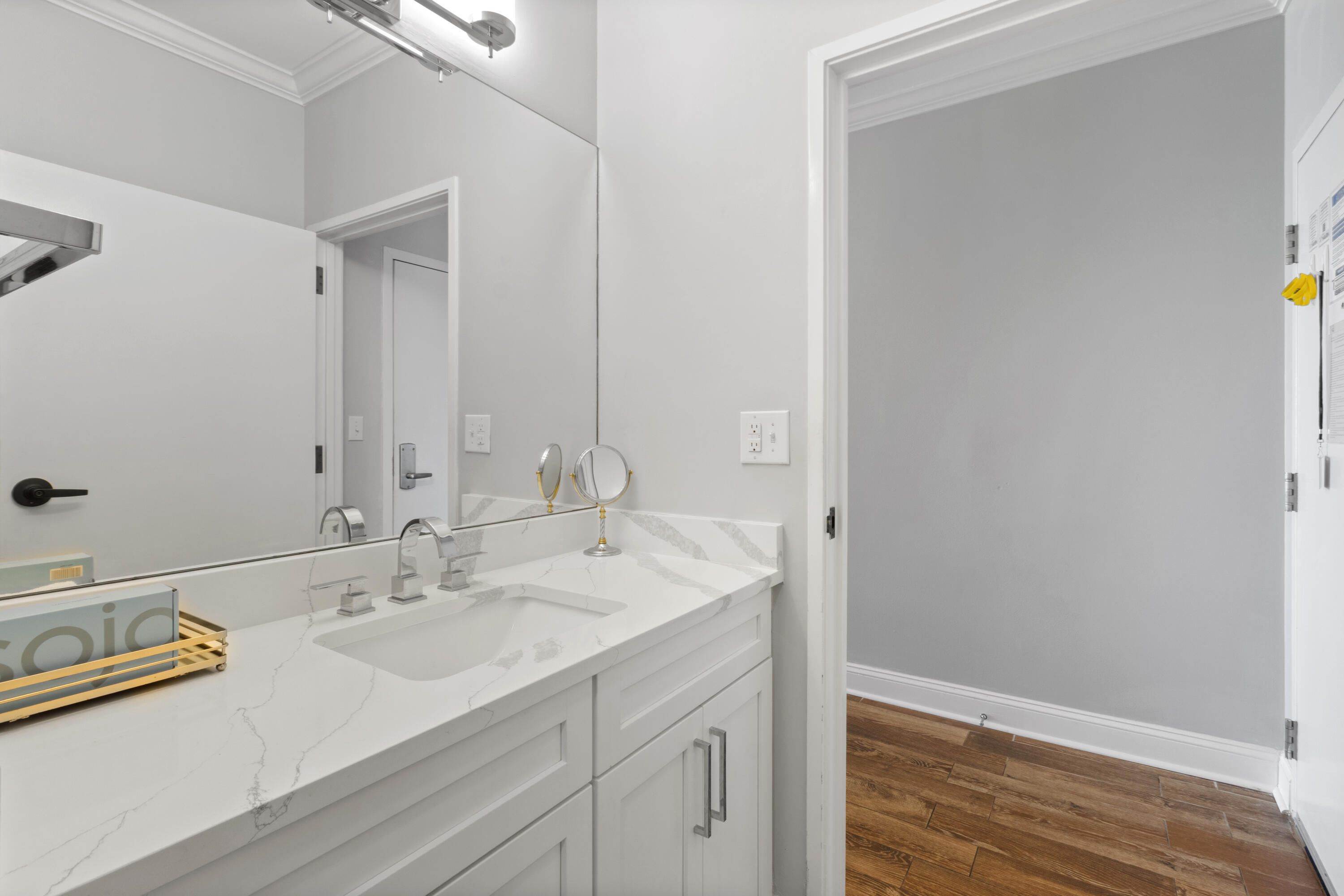 550 Tops'l Beach Boulevard, Unit 103 Miramar Beach, FL 32550 - Photo 17 of 20 a bathroom with a sink and a mirror
