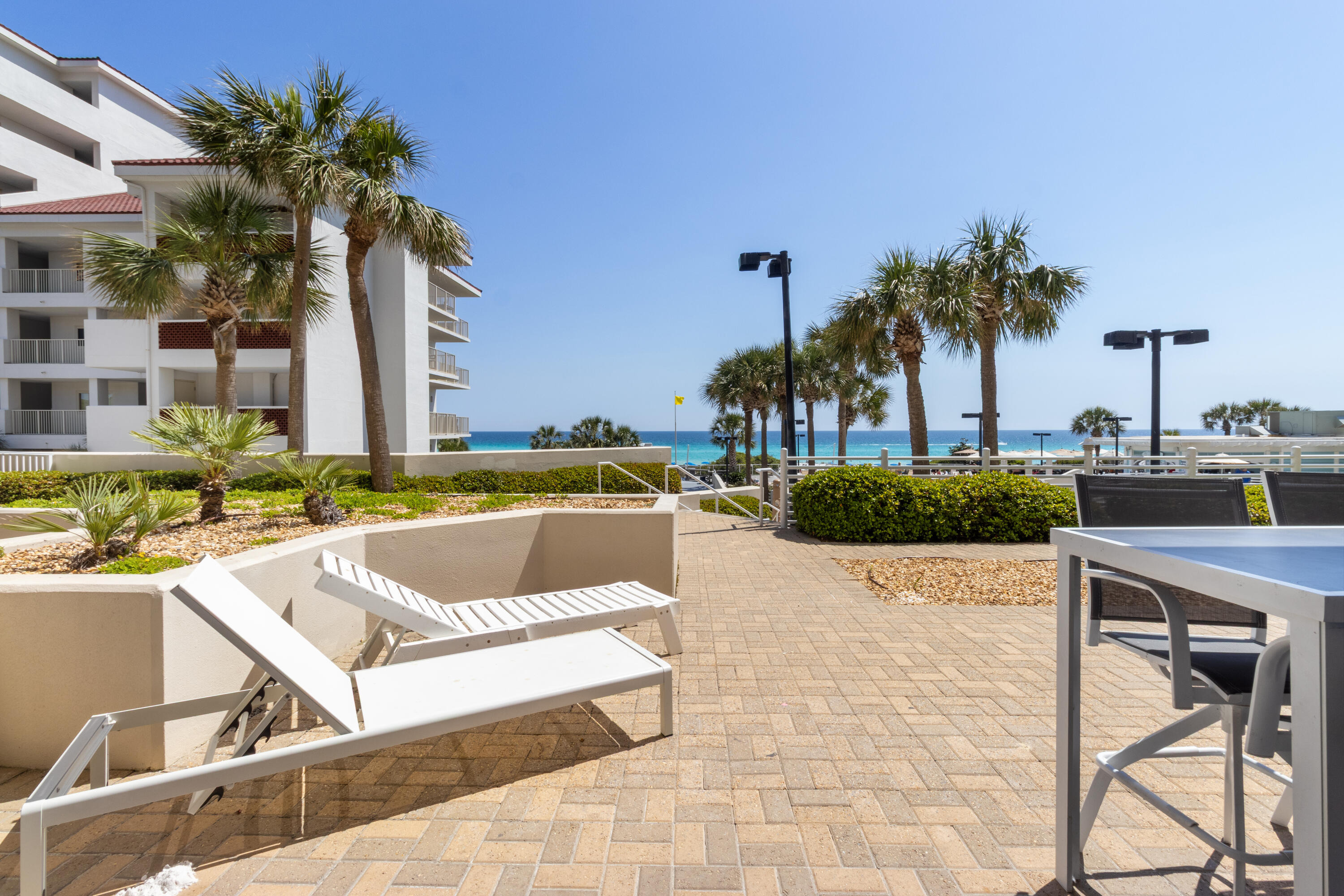 550 Tops'l Beach Boulevard, Unit 103 Miramar Beach, FL 32550 - Photo 3 of 20 a view of a swimming pool with a lounge chairs
