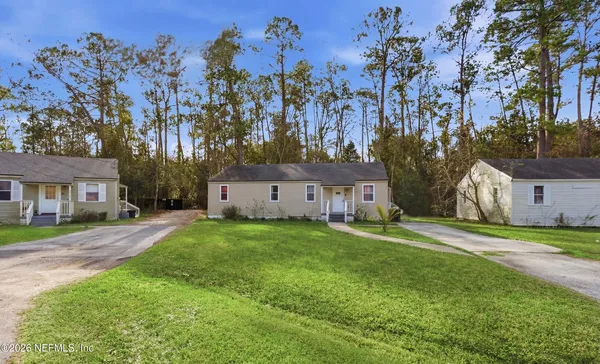 a view of a house with a yard