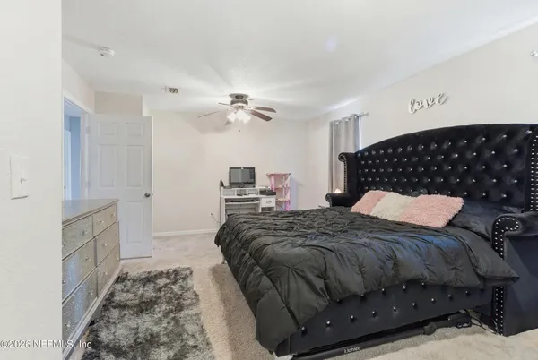 a bedroom with a bed and cabinets