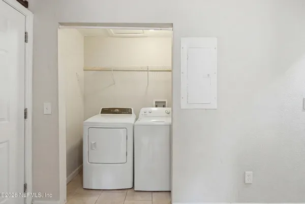 a utility room with dryer and washer