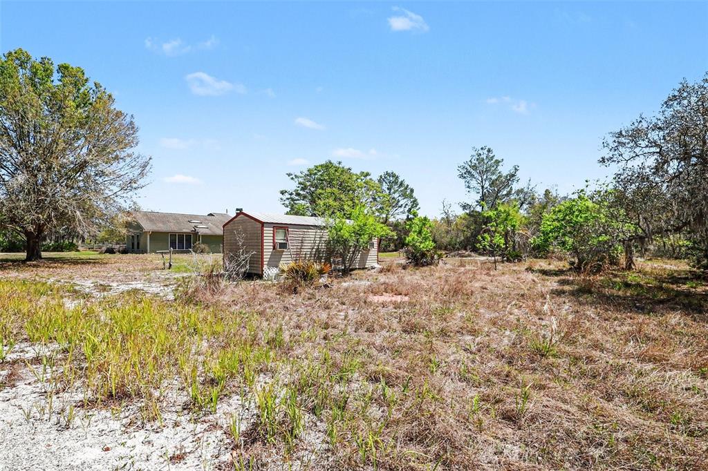 58 Deer Road Frostproof, FL 33843 - Photo 18 of 20 a view of a house with a yard