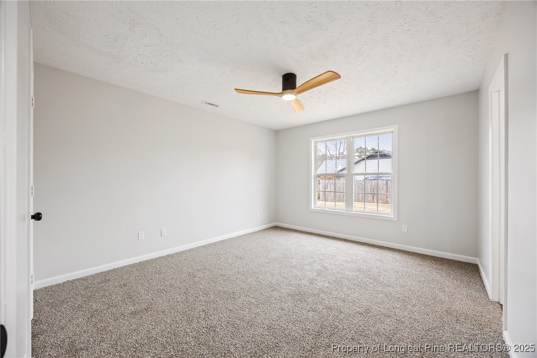 122 Tanner Loop Raeford, NC 28376 - Photo 15 of 36 a view of an empty room with a window