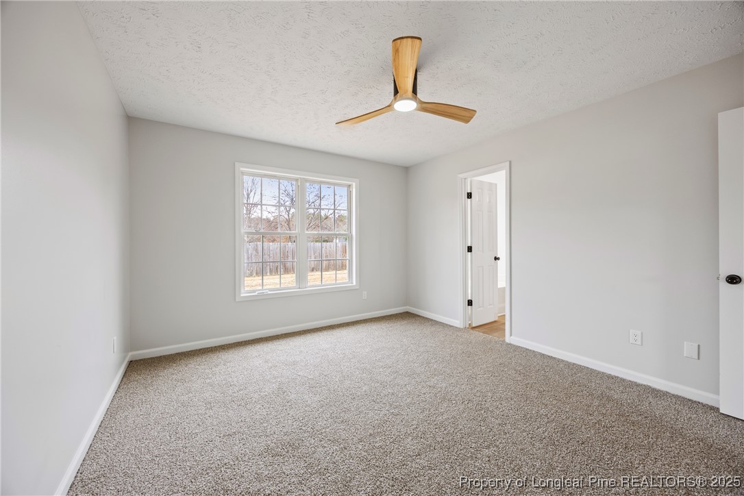 122 Tanner Loop Raeford, NC 28376 - Photo 18 of 36 a view of an empty room with a window