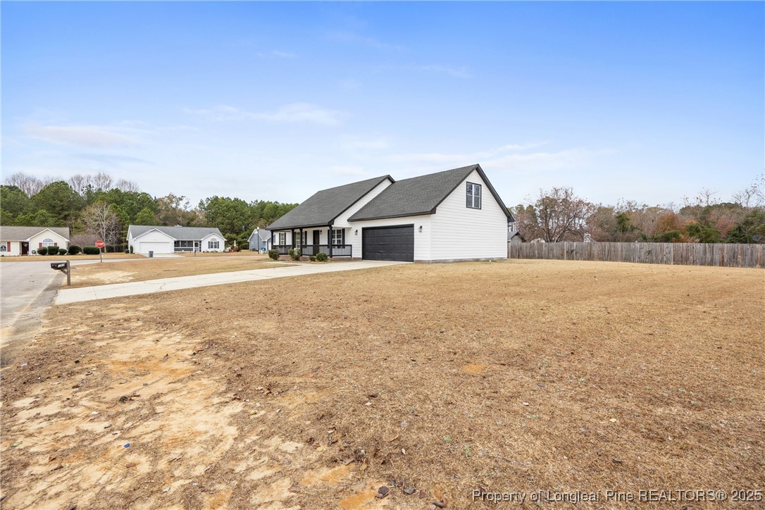 122 Tanner Loop Raeford, NC 28376 - Photo 2 of 36 a view of lake and mountain view