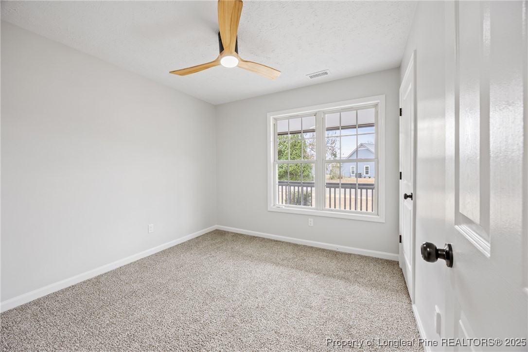 122 Tanner Loop Raeford, NC 28376 - Photo 23 of 36 a view of an empty room with a window
