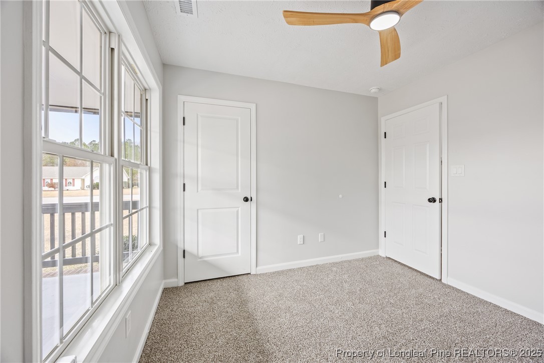 122 Tanner Loop Raeford, NC 28376 - Photo 24 of 36 a view of an empty room with a window
