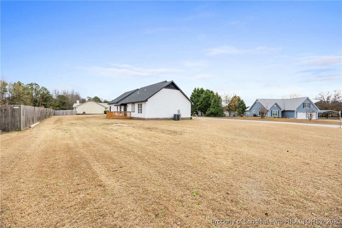 122 Tanner Loop Raeford, NC 28376 - Photo 35 of 36 a view of an house with outdoor space and seating area