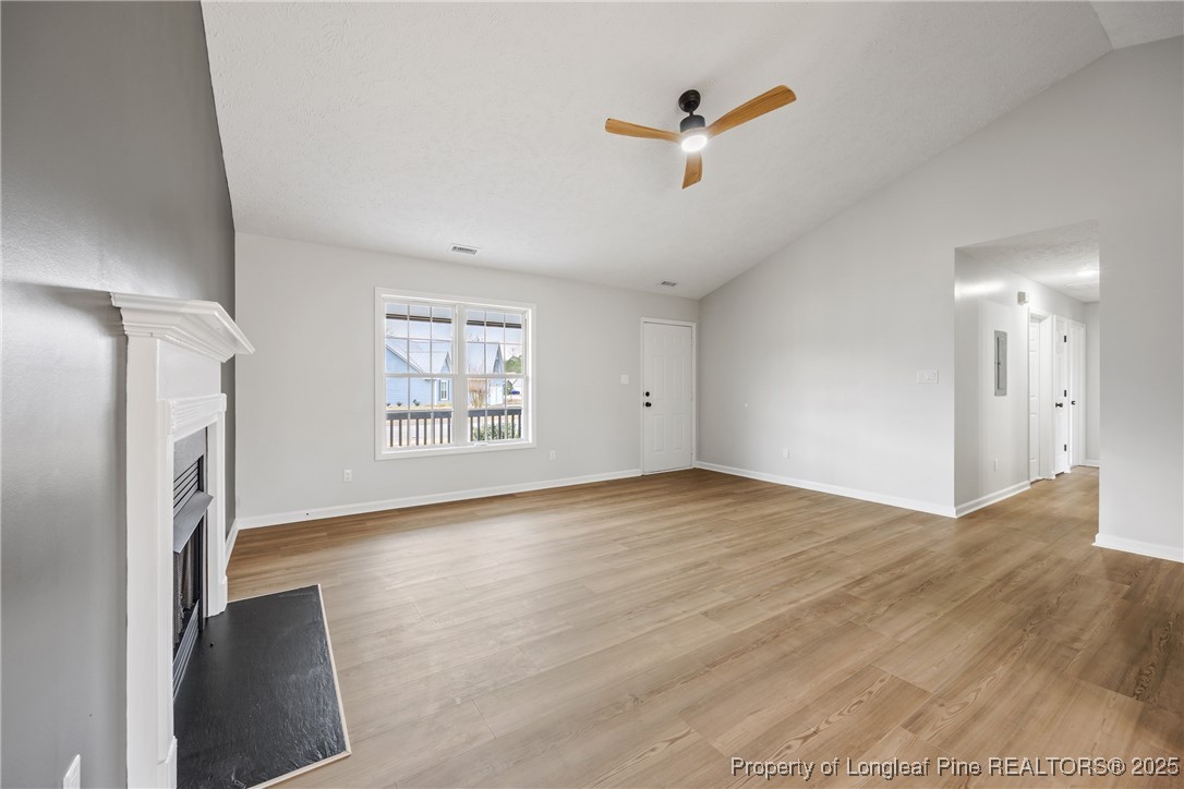 122 Tanner Loop Raeford, NC 28376 - Photo 6 of 36 wooden floor in an empty room with a window
