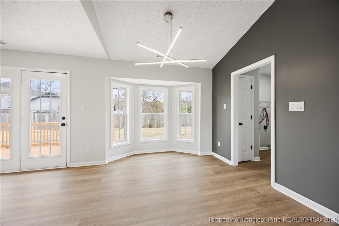 122 Tanner Loop Raeford, NC 28376 - Photo 8 of 36 a view of an empty room with glass door