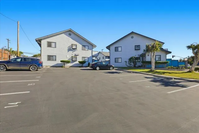 a kitchen with refrigerator a sink and cabinets