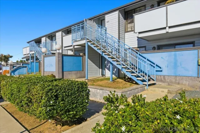 a view of a house with a street