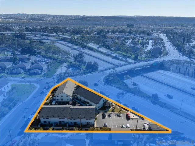 a front view of a house with a street