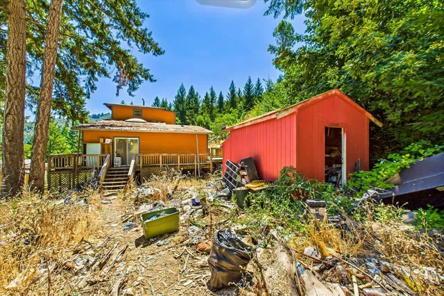 an outdoor view of a house with swimming pool