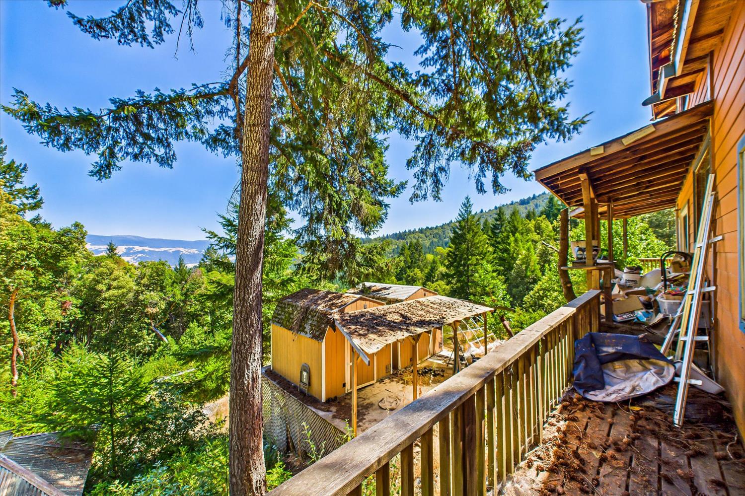 5500 Rancho Sequoia Drive Alderpoint, CA 95511 - Photo 14 of 30 a view of a balcony with chairs