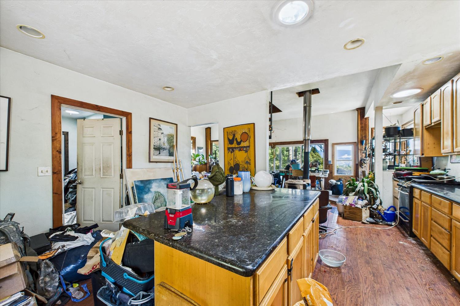 5500 Rancho Sequoia Drive Alderpoint, CA 95511 - Photo 22 of 30 a living room with furniture a flat screen tv and a large window