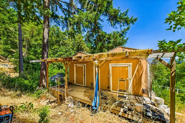 front view of a house with a tree