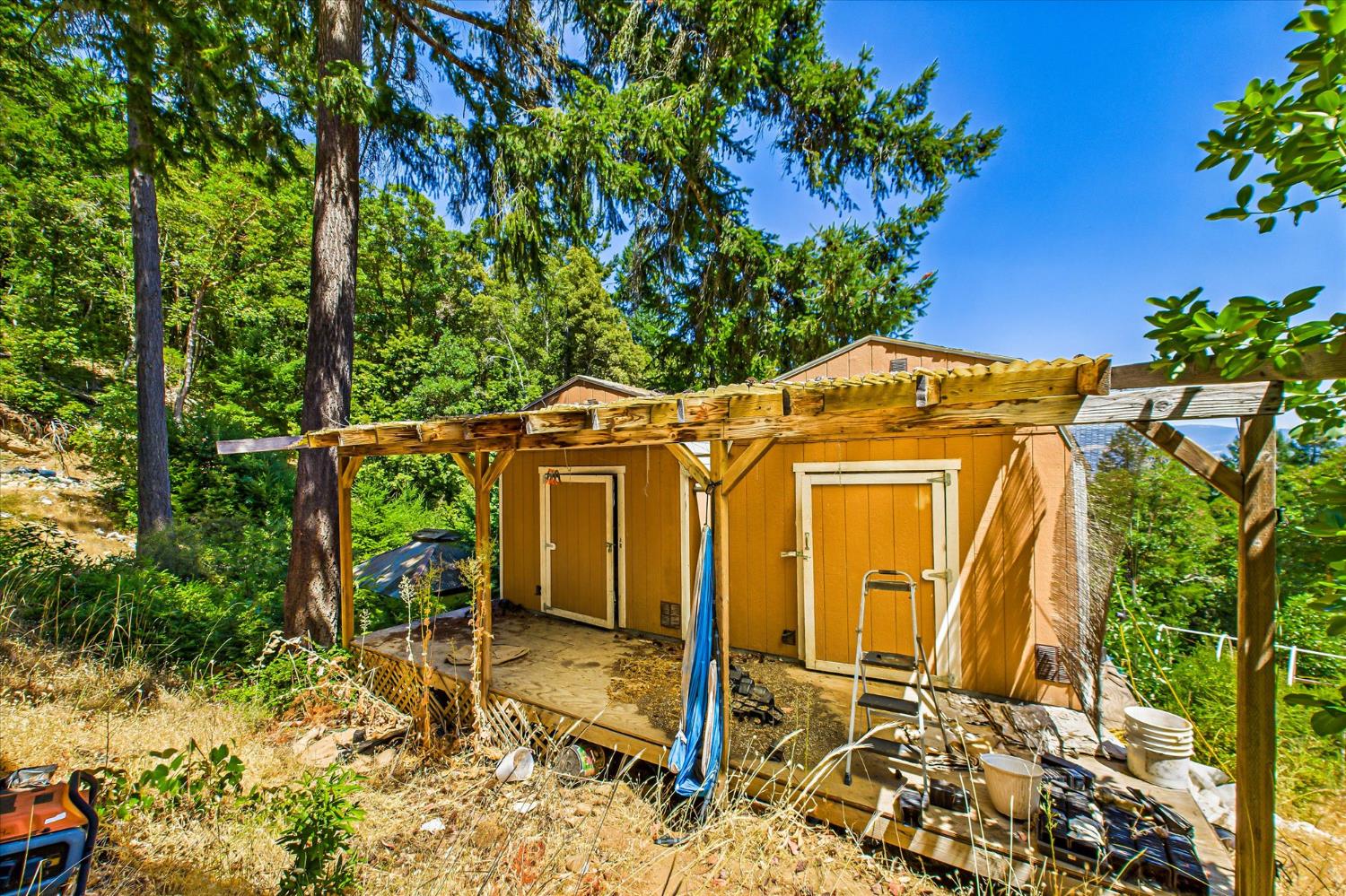 5500 Rancho Sequoia Drive Alderpoint, CA 95511 - Photo 26 of 30 front view of a house with a tree