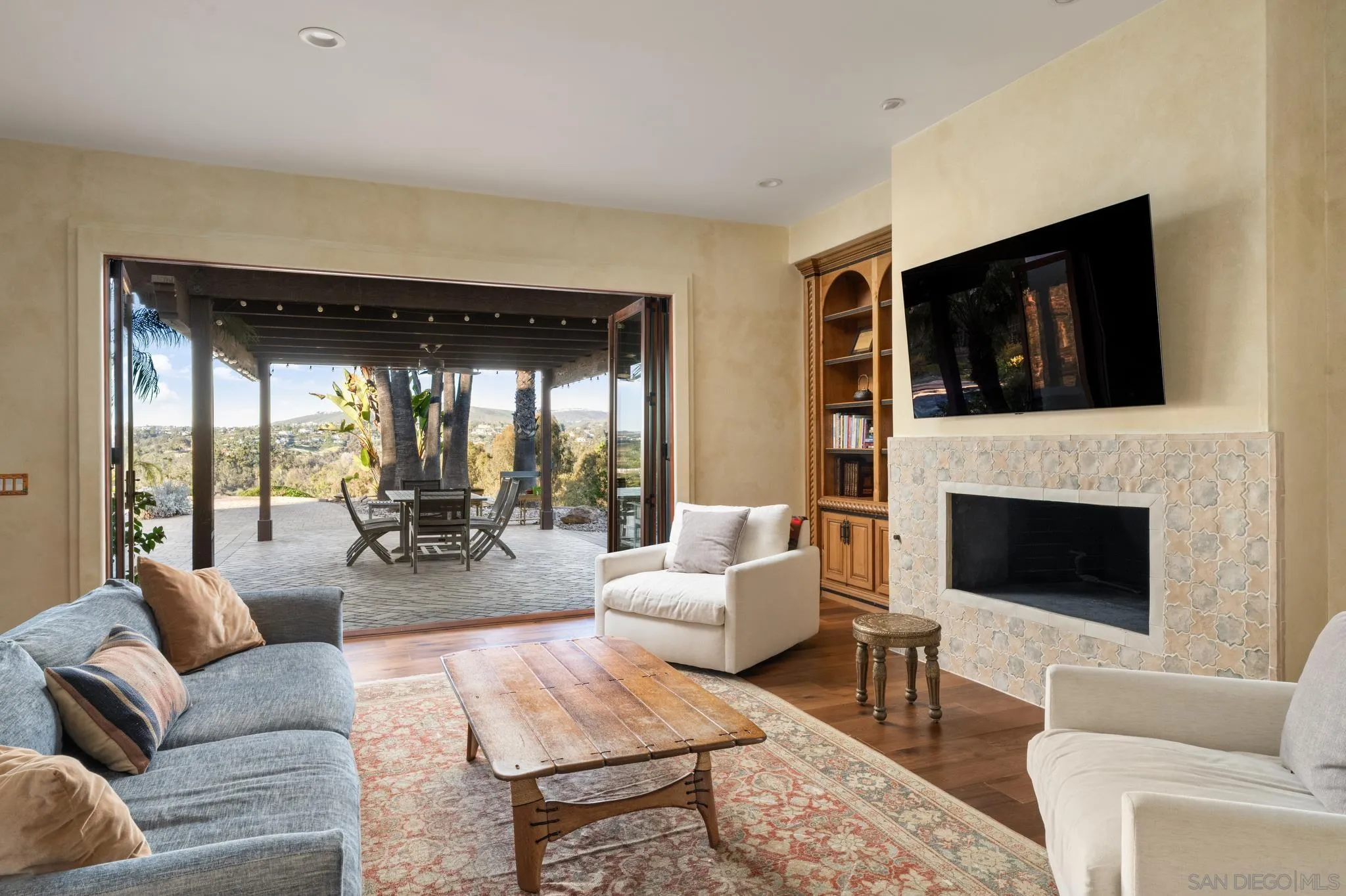 3028 Paseo Cielo Rancho Santa Fe, CA 92024 - Photo 9 of 50 a living room with furniture and a fireplace