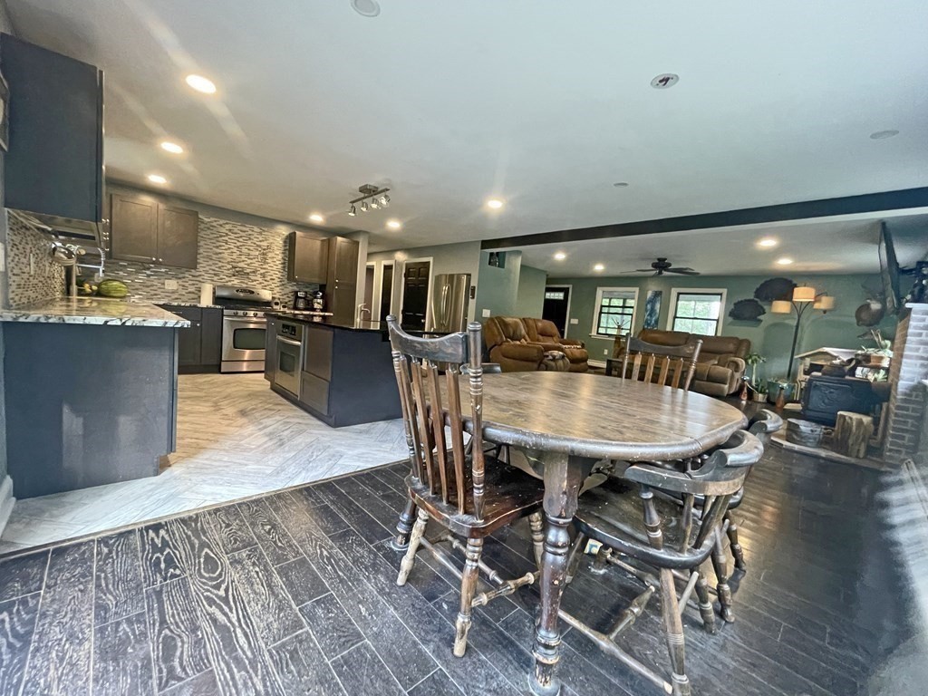 241 Thompson Road Colrain, MA 01340 - Photo 13 of 42 a dining room with furniture and wooden floor
