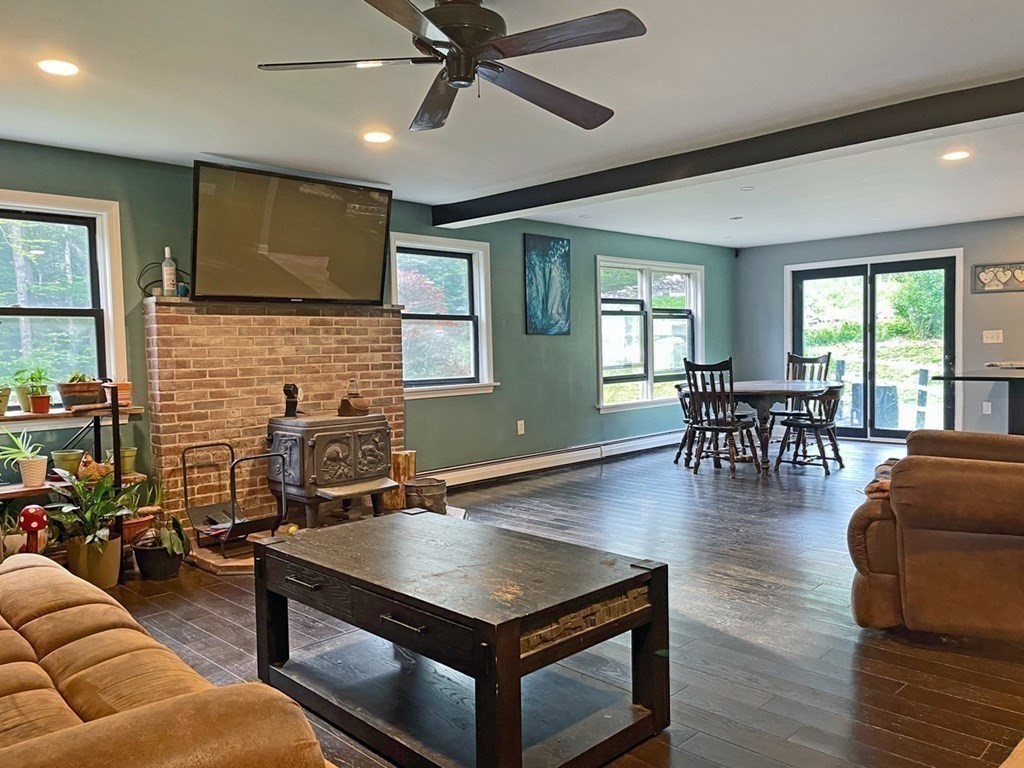 241 Thompson Road Colrain, MA 01340 - Photo 14 of 42 a living room with furniture and wooden floor