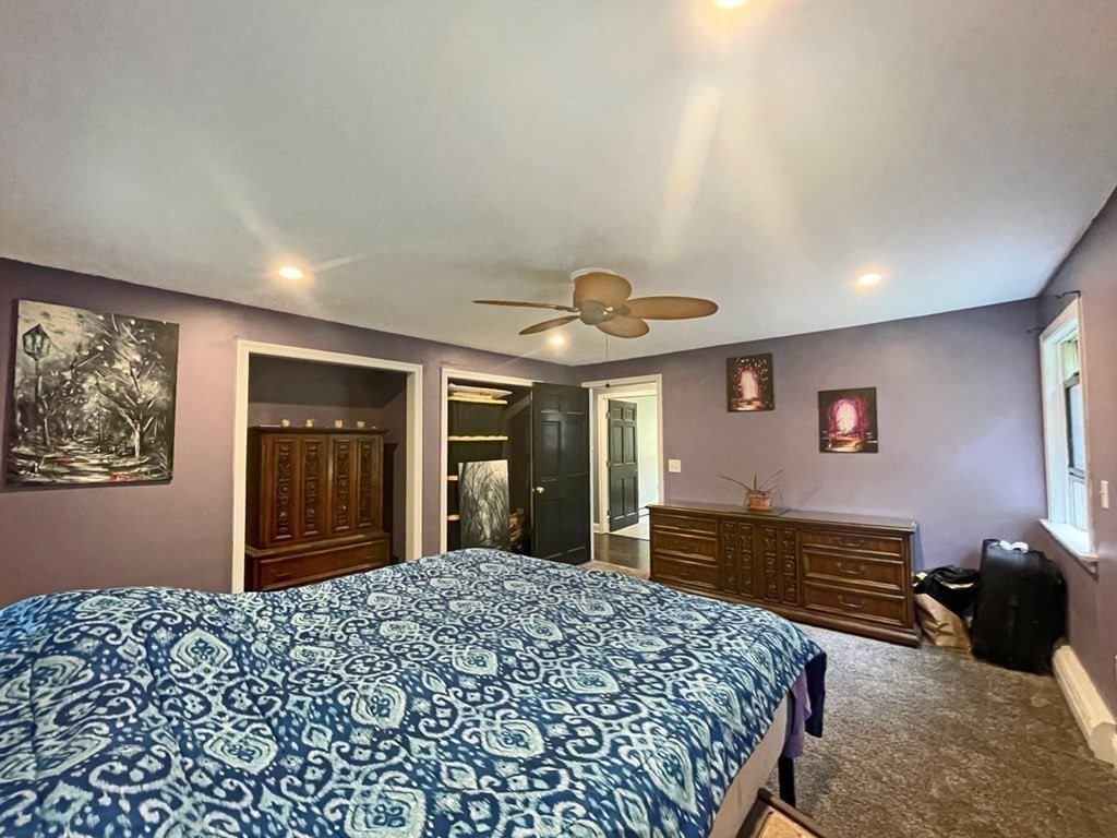 241 Thompson Road Colrain, MA 01340 - Photo 23 of 42 a bedroom with a bed and a dresser