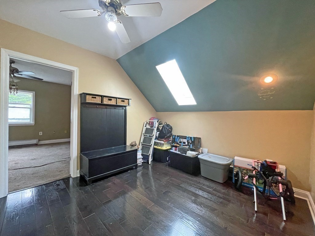 241 Thompson Road Colrain, MA 01340 - Photo 27 of 42 a living room with furniture and a ceiling fan