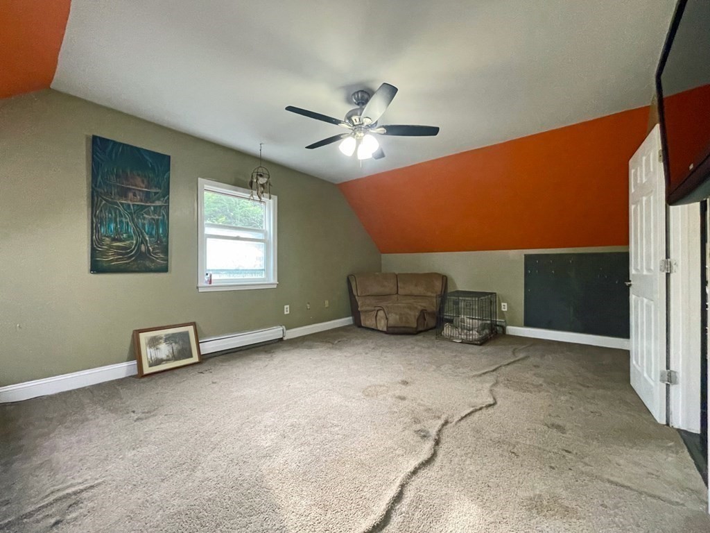241 Thompson Road Colrain, MA 01340 - Photo 29 of 42 a view of a livingroom with furniture and a ceiling fan