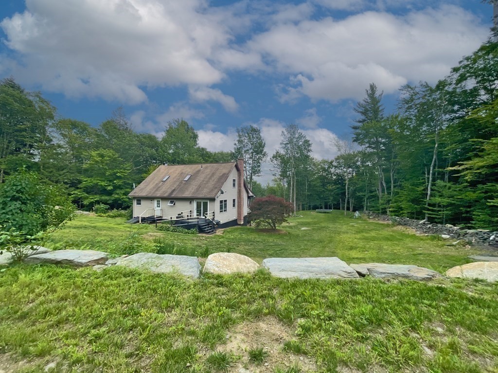 241 Thompson Road Colrain, MA 01340 - Photo 38 of 42 a view of a big house with a big yard and large trees