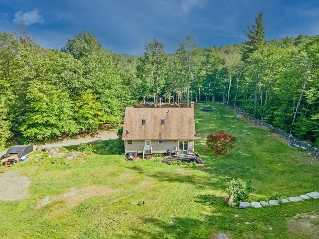 241 Thompson Road Colrain, MA 01340 - Photo 9 of 42 a garden view with a seating space
