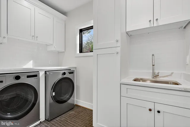 a bedroom with bed and wall painting
