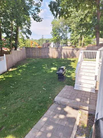 a view of a backyard with tree s