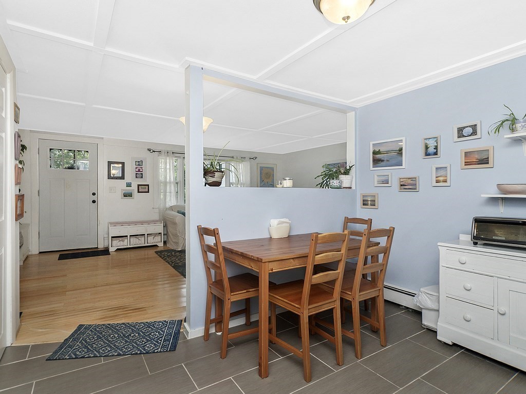 2 Filias, Unit 1 Manchester, MA 01944 - Photo 2 of 11 a view of a dining room with furniture