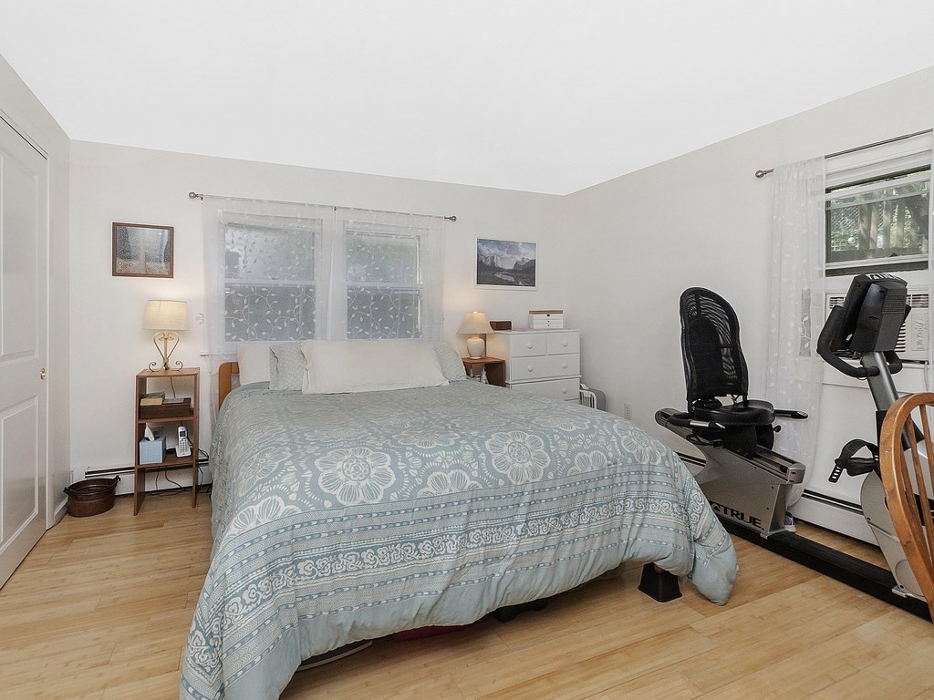 2 Filias, Unit 1 Manchester, MA 01944 - Photo 5 of 11 a bedroom with bed and a window