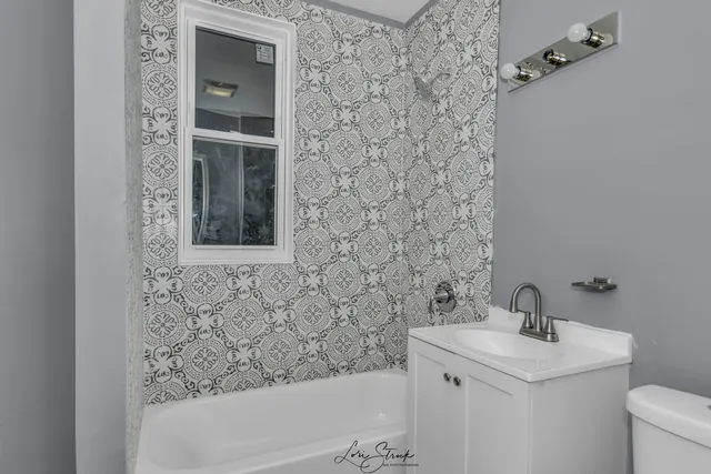 a bathroom with a sink and a bathtub