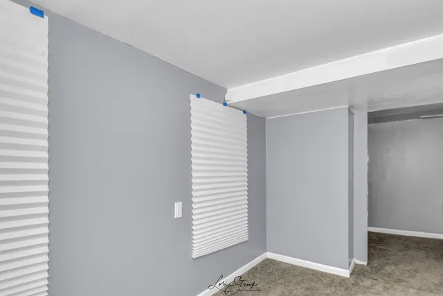 a view of a hallway to rooms