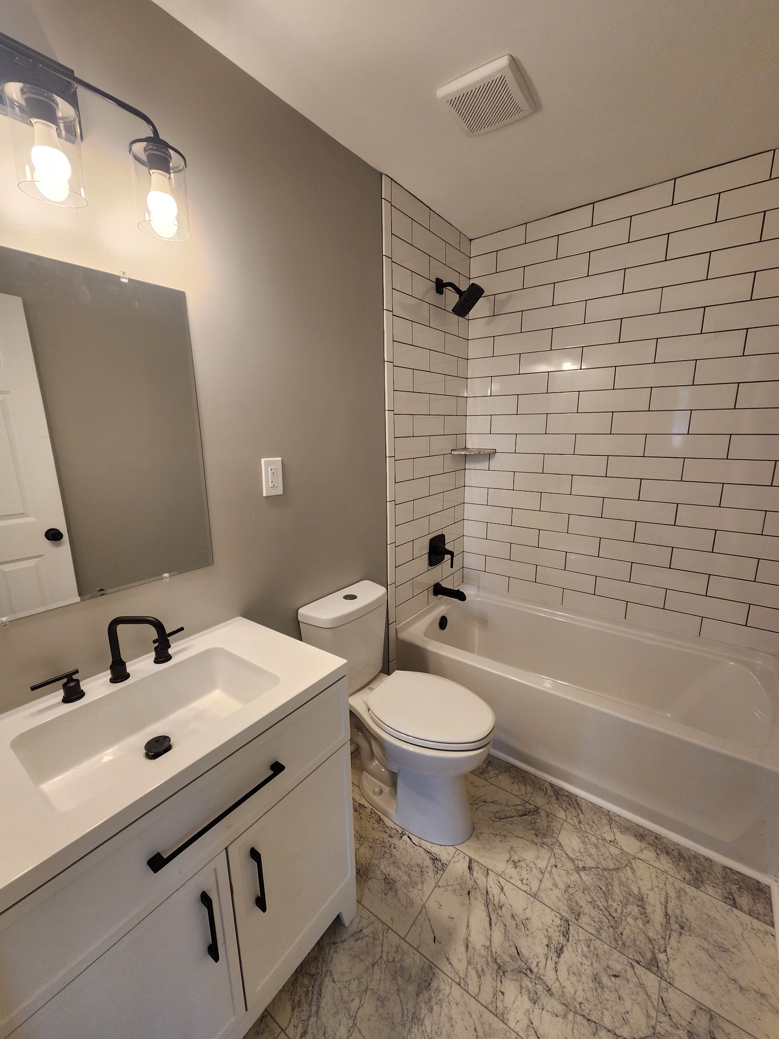 1301 Riley Hill Road Pulaski, TN 38478 - Photo 13 of 23 a bathroom with a double vanity sink toilet and shower
