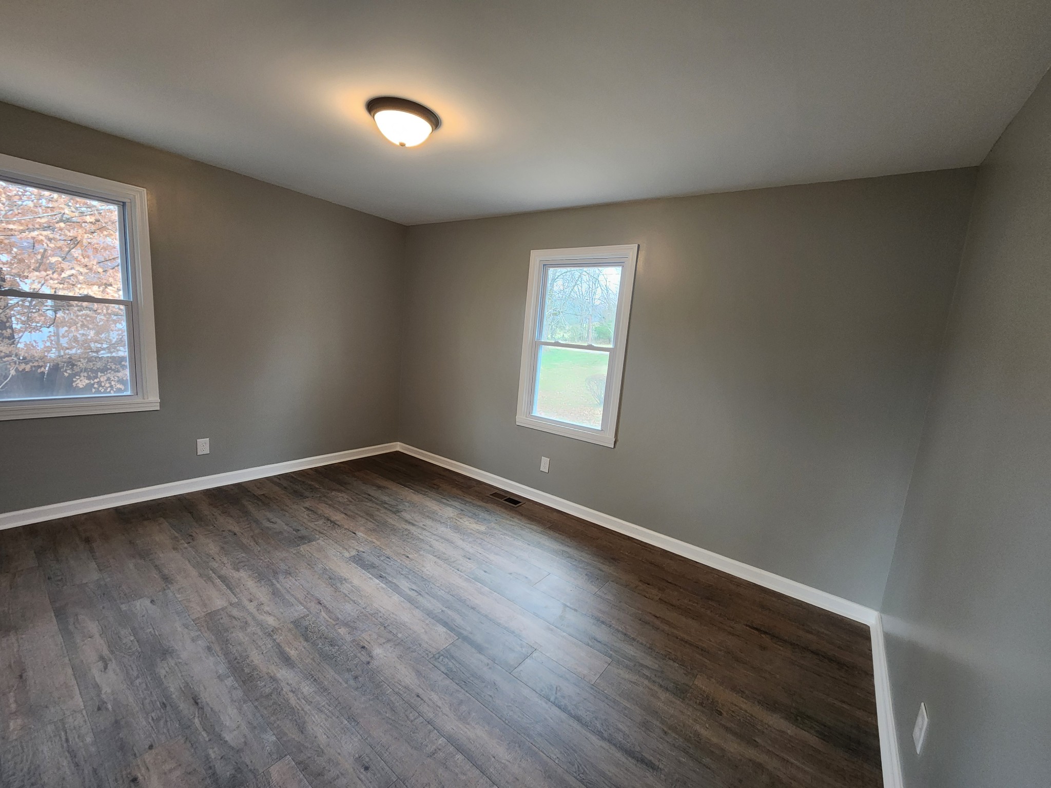 1301 Riley Hill Road Pulaski, TN 38478 - Photo 19 of 23 an empty room with wooden floor and windows