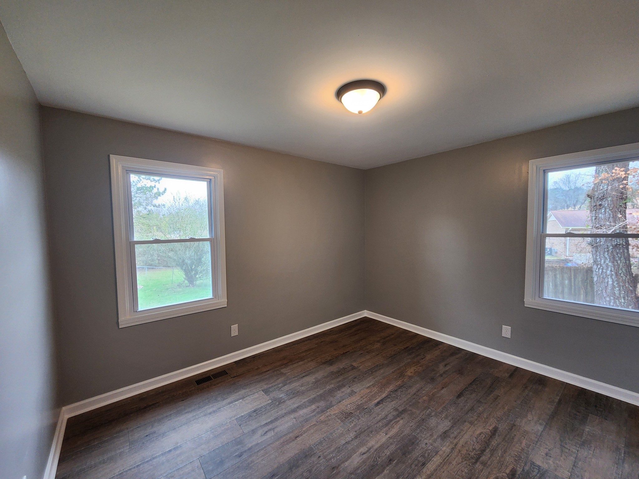 1301 Riley Hill Road Pulaski, TN 38478 - Photo 20 of 23 an empty room with wooden floor and windows