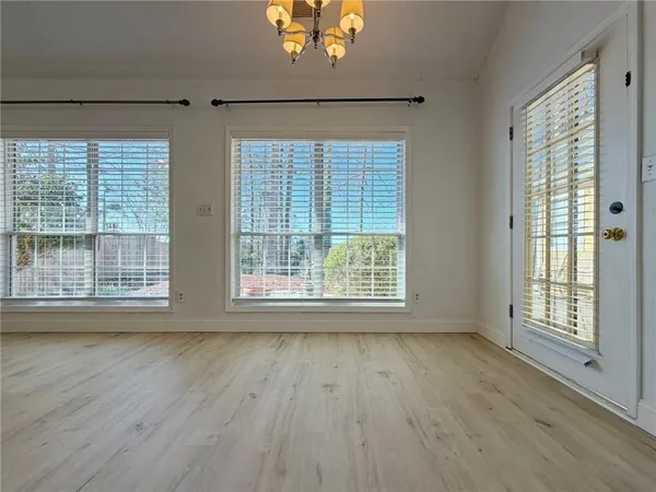 a view of a kitchen with a stove cabinets and a chandelier