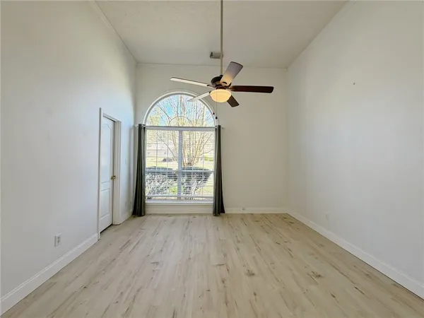 a bathroom with a shower a toilet and sink