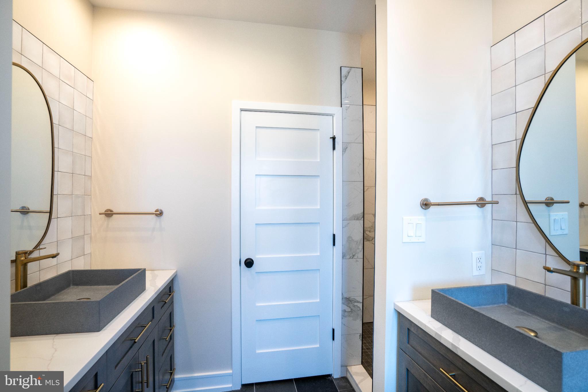 390 Trout Road State College, PA 16801 - Photo 61 of 78 Elegant dual-sink bathroom with modern finishes.
