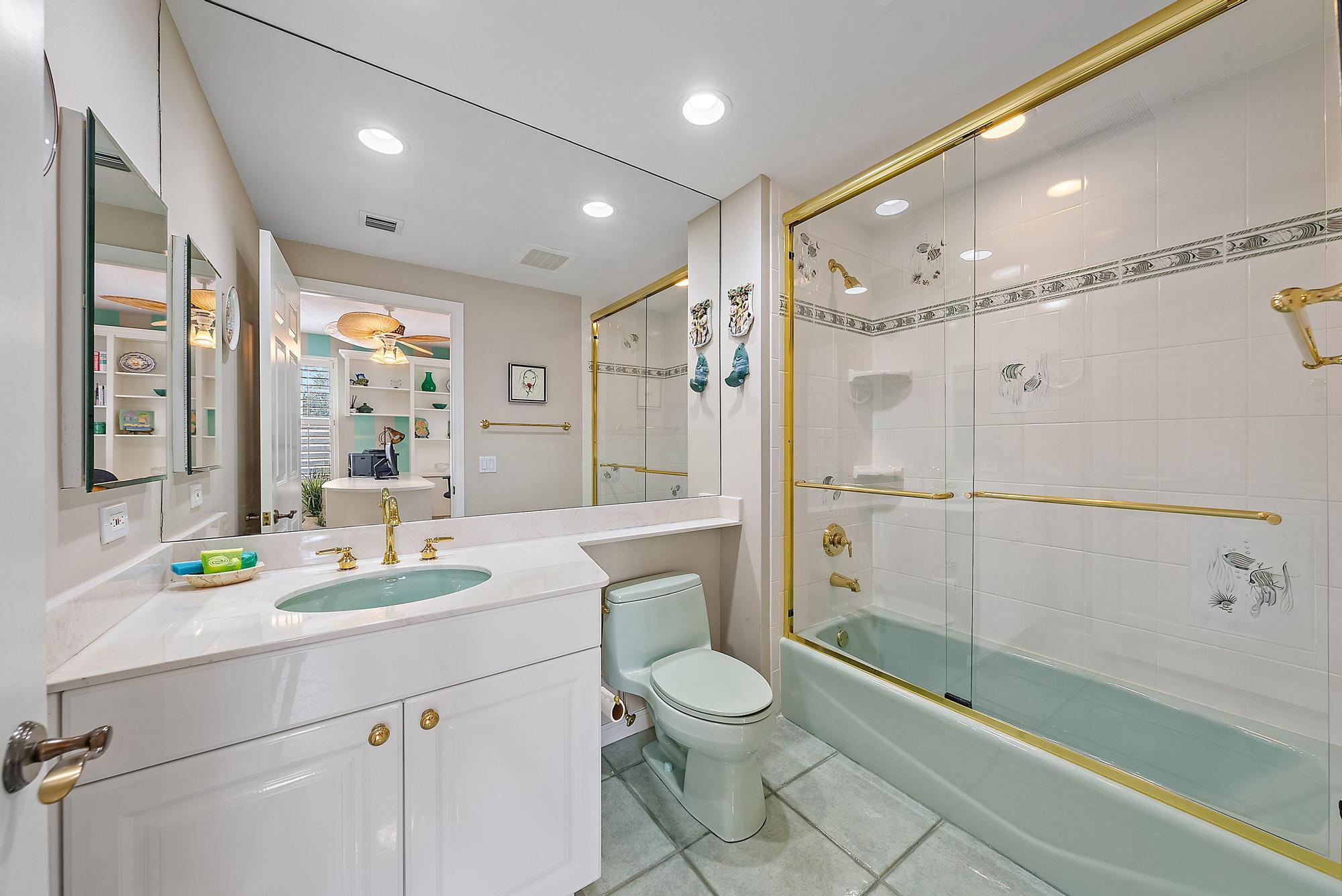 400 Highway 1, Unit 104 Jupiter, FL 33477 - Photo 15 of 35 a bathroom with a sink toilet and shower