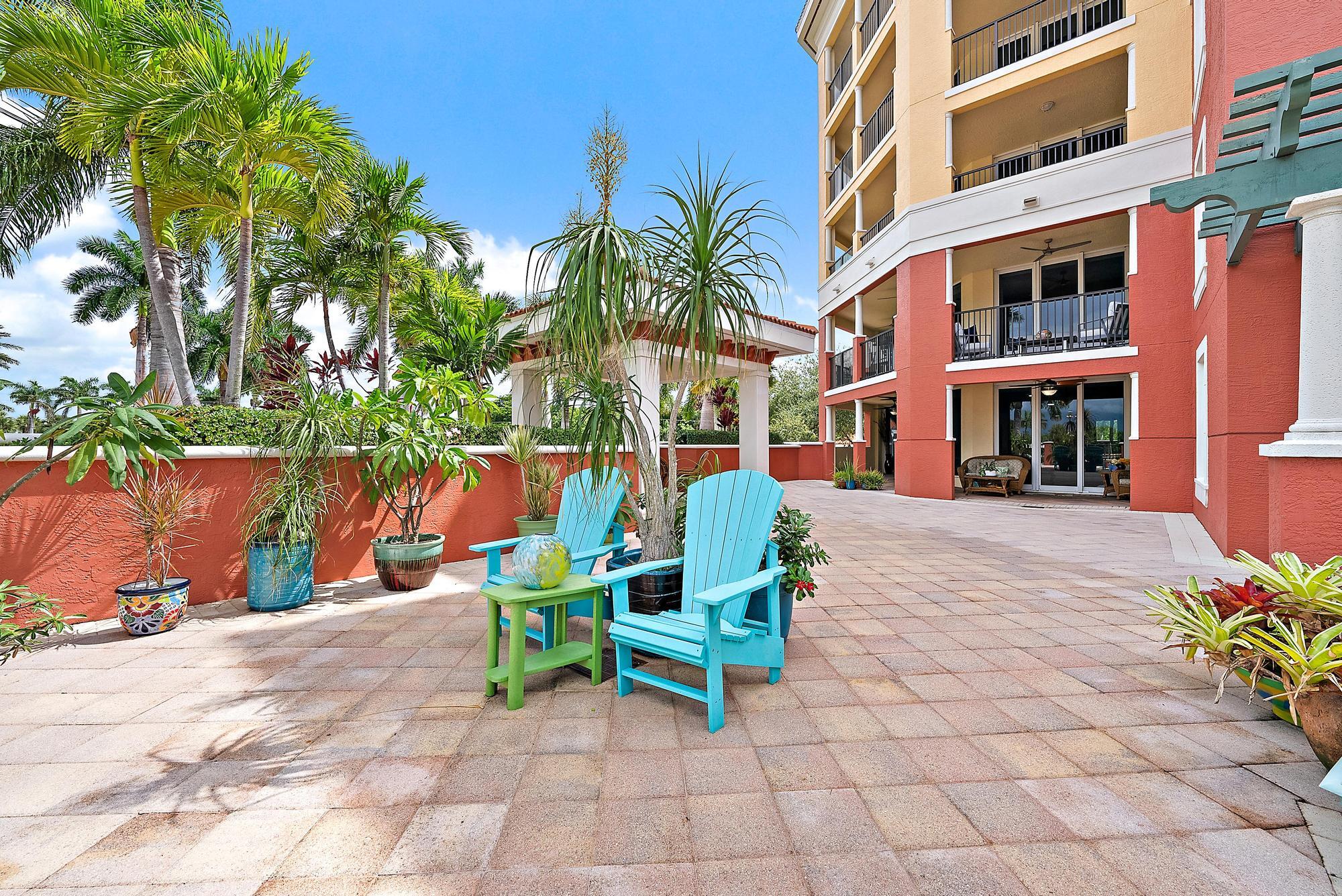 400 Highway 1, Unit 104 Jupiter, FL 33477 - Photo 21 of 35 a bench sitting in front of a building