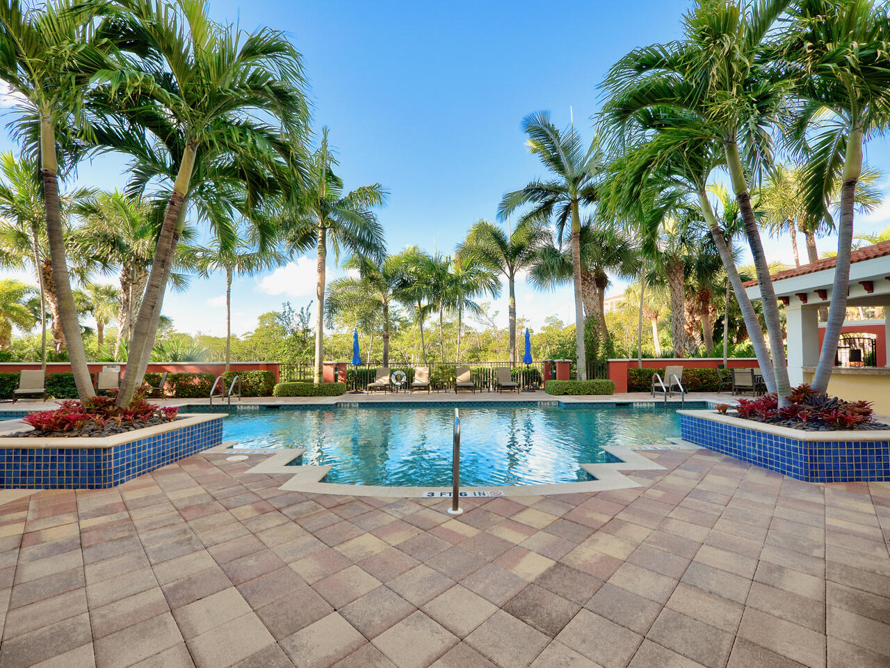 400 Highway 1, Unit 104 Jupiter, FL 33477 - Photo 26 of 35 a view of a swimming pool and lounge chair