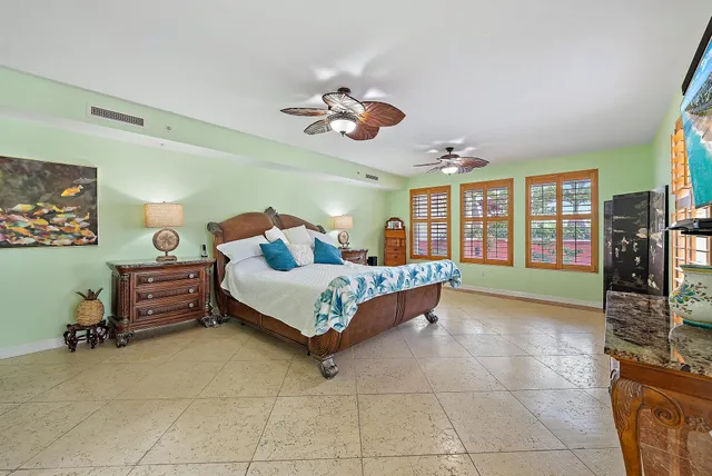 a bedroom with a bed and cabinets