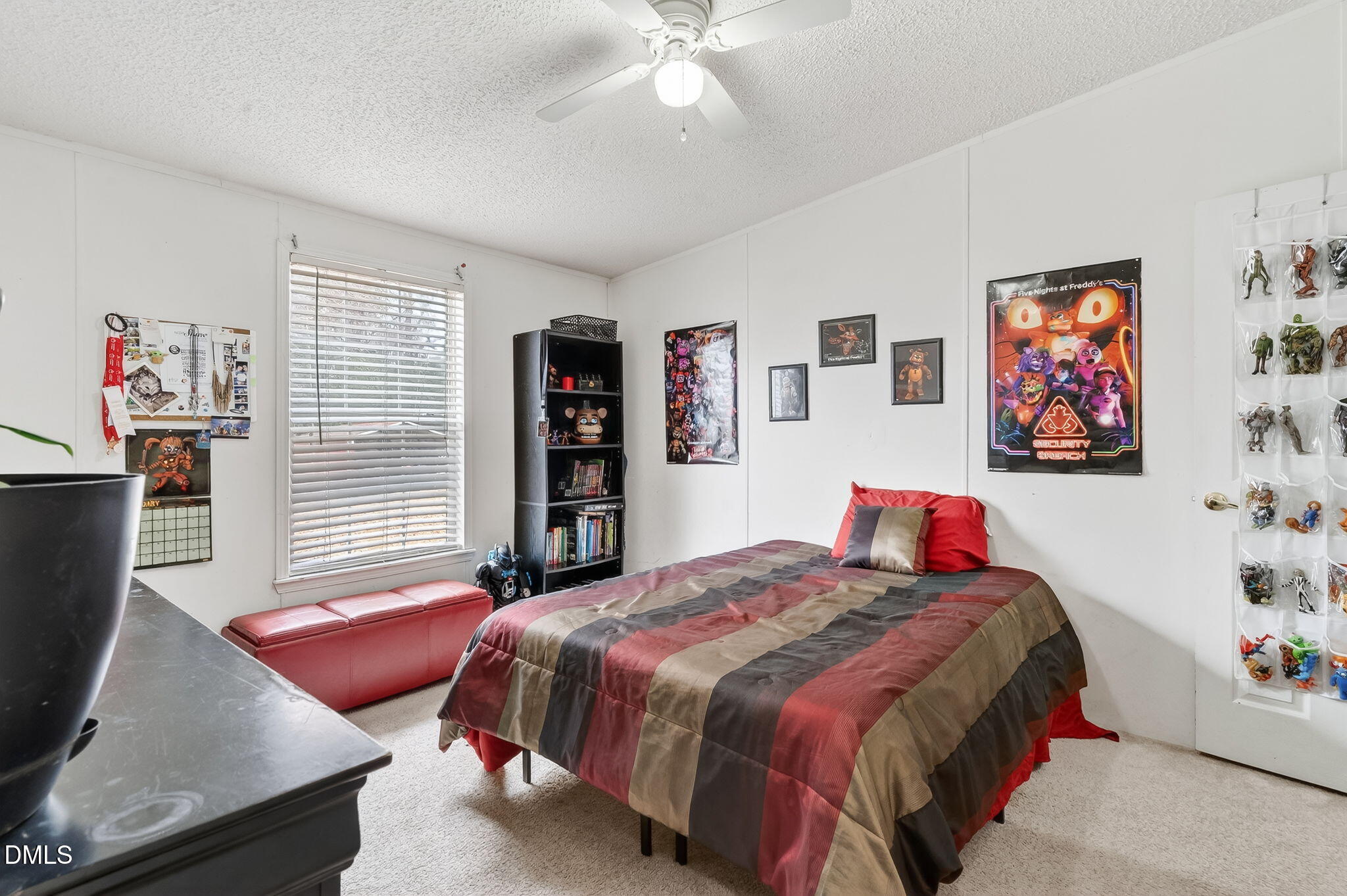 112 Morgan Street Erwin, NC 28339 - Photo 19 of 35 a bed room with a bed and a couch