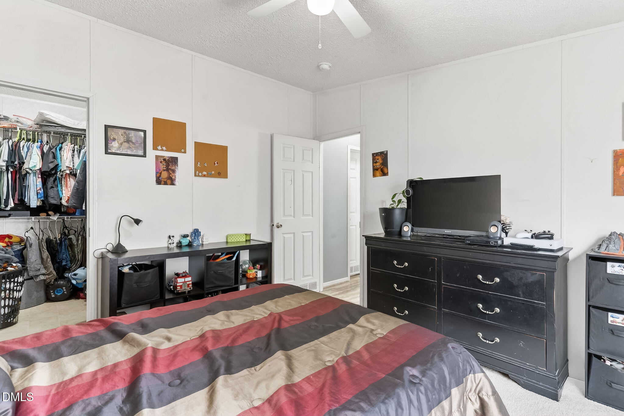 112 Morgan Street Erwin, NC 28339 - Photo 20 of 35 a bedroom with a bed and a flat screen tv