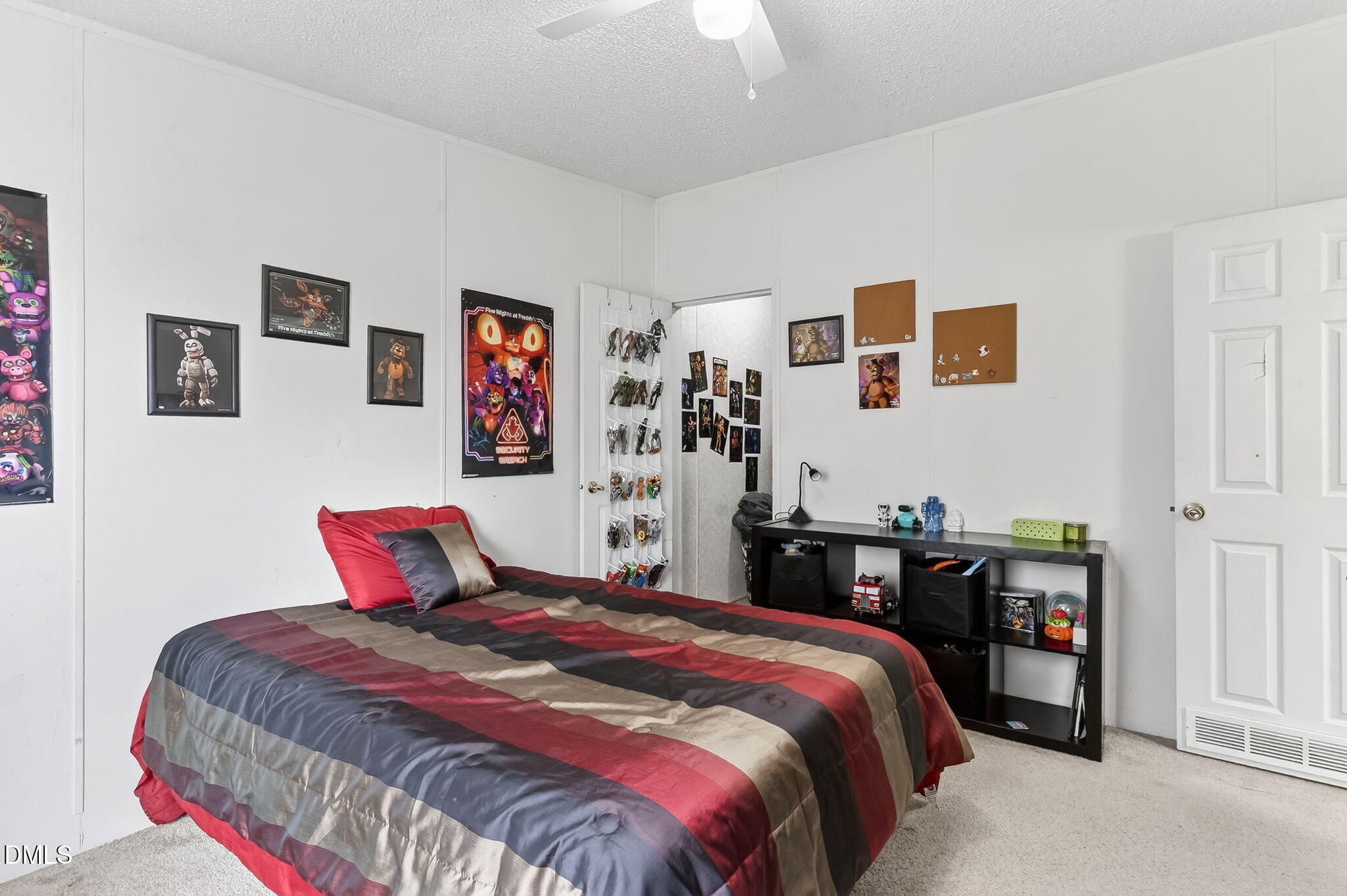 112 Morgan Street Erwin, NC 28339 - Photo 21 of 35 a bedroom with a bed and wall painting